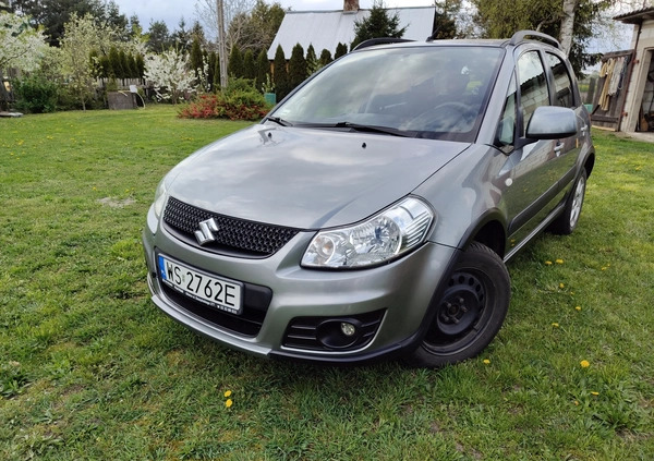 Suzuki SX4 cena 34500 przebieg: 135140, rok produkcji 2013 z Szczecinek małe 211